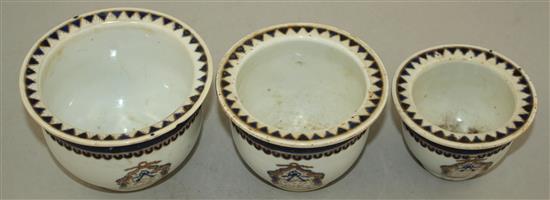 An unusual set of three graduated Chinese export enamelled porcelain flower pots, early 19th century, largest 11.5cm